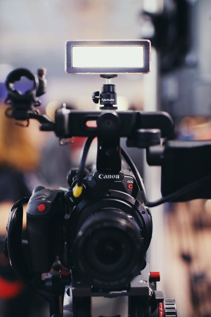 Close-up of a professional video camera with lighting equipment, perfect for filmmaking or video production projects.